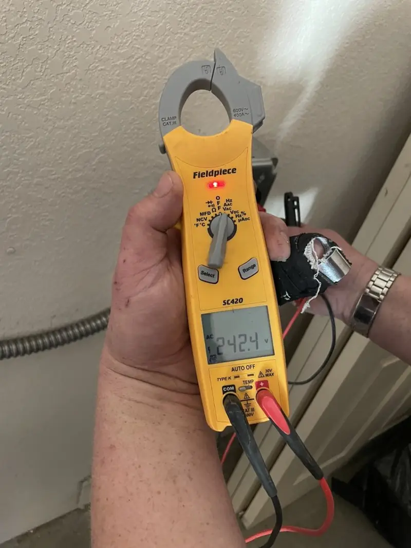 Voltage testing with clamp meter during Electrical Installation Services in Kirkland